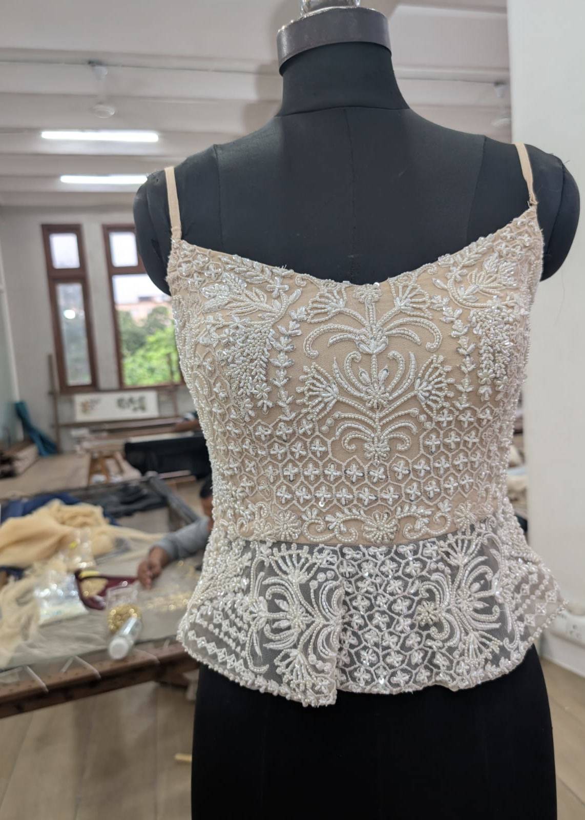 Ivory Beaded Peplum Lehenga Image - 1